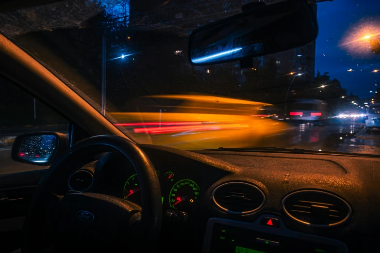 a traffic light is on in front of the dashboard of a car