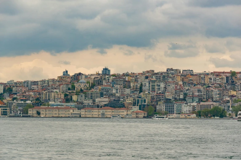 there is a cityscape sitting on top of the hill