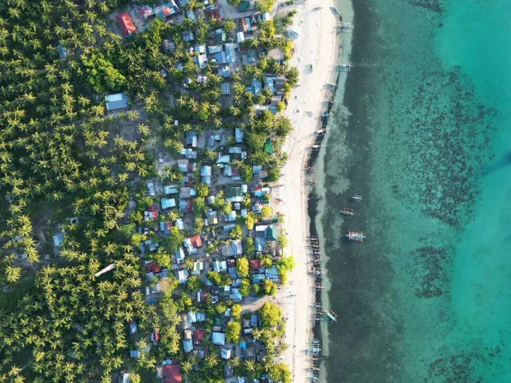 a view from the air of houses and boats on a lake