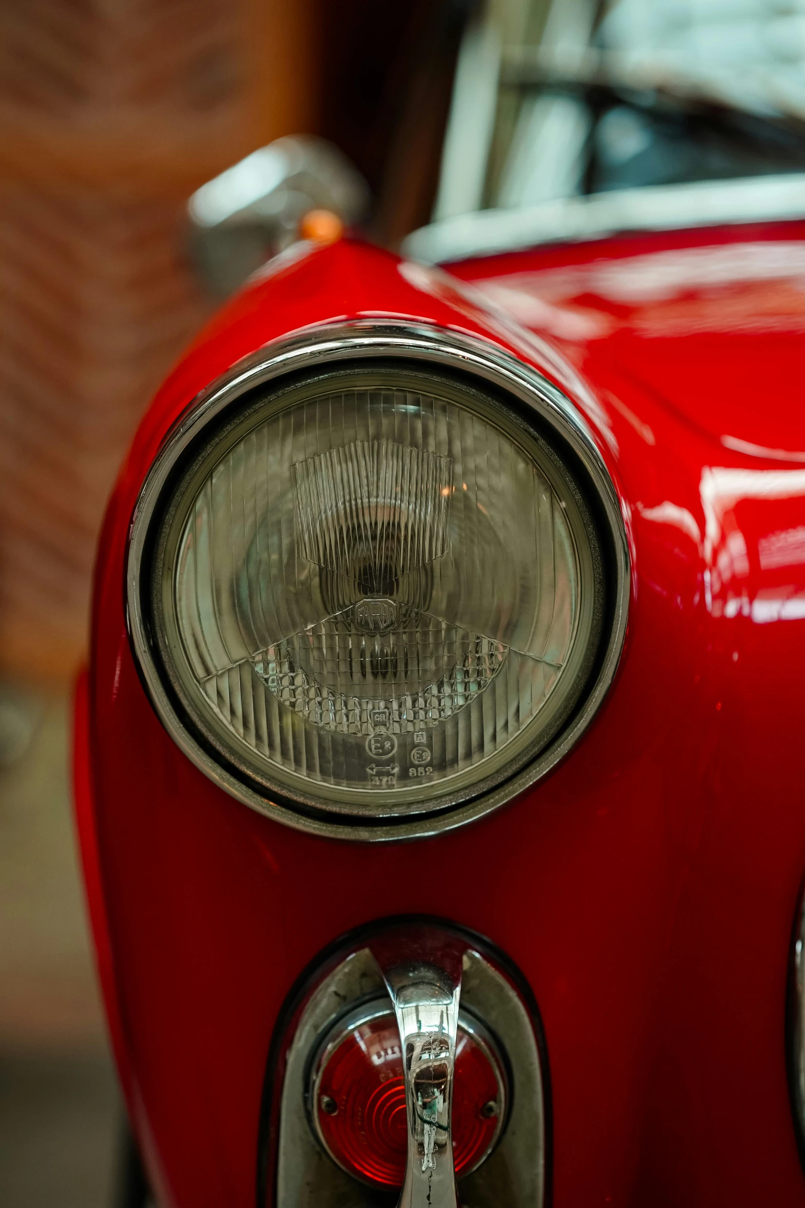 this is the front light of an old, red car