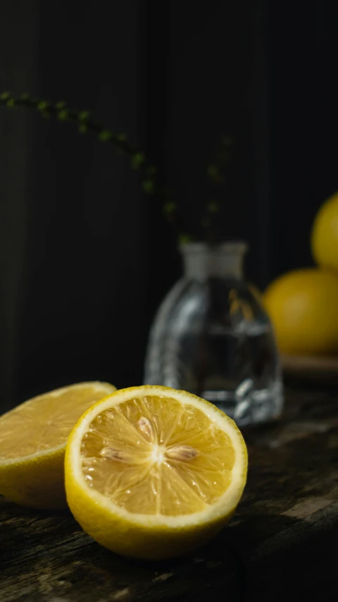 a couple of lemons sitting on top of a table