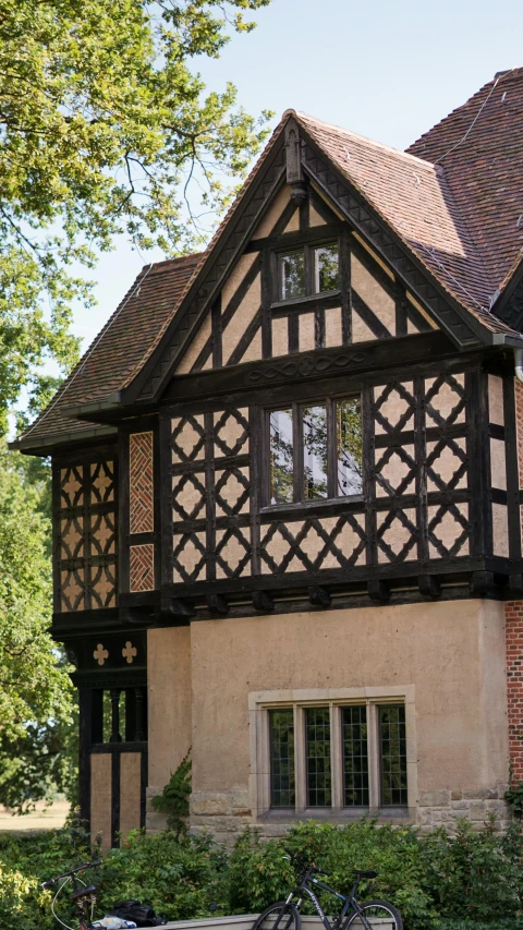 a house with an interesting design and the door is open