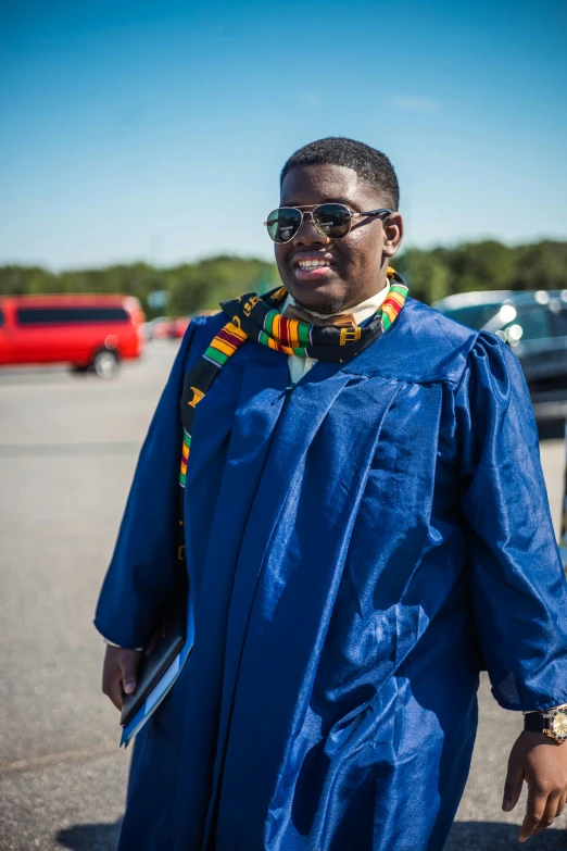 a male student in a graduation gown