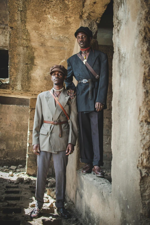 two men standing by each other in a doorway