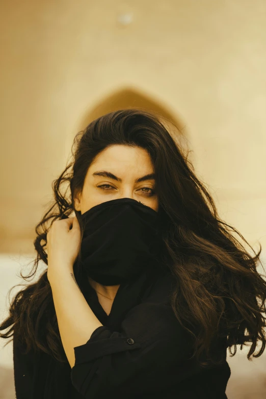 a woman covering her face with a handkerchief