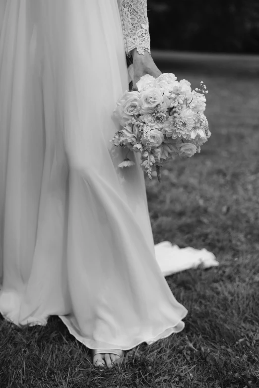 black and white pograph of a bride holding a bouquet