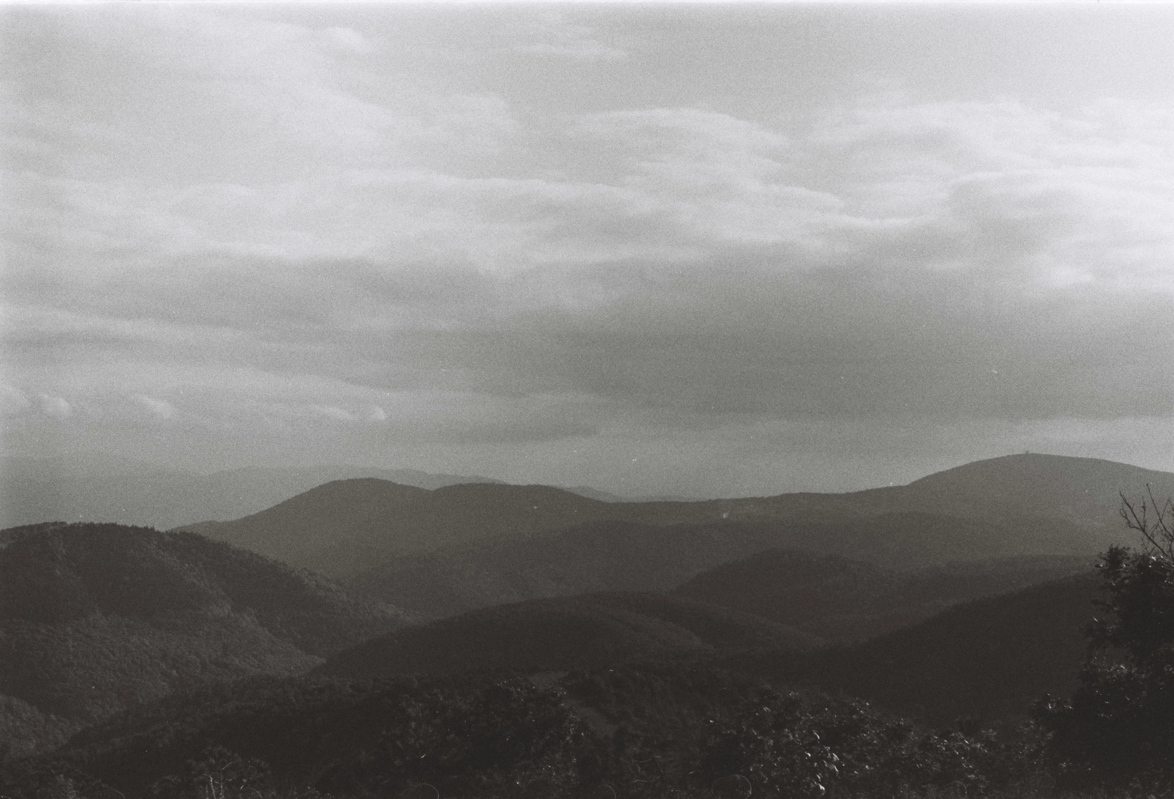 there is a mountain range in the distance with mountains in the background