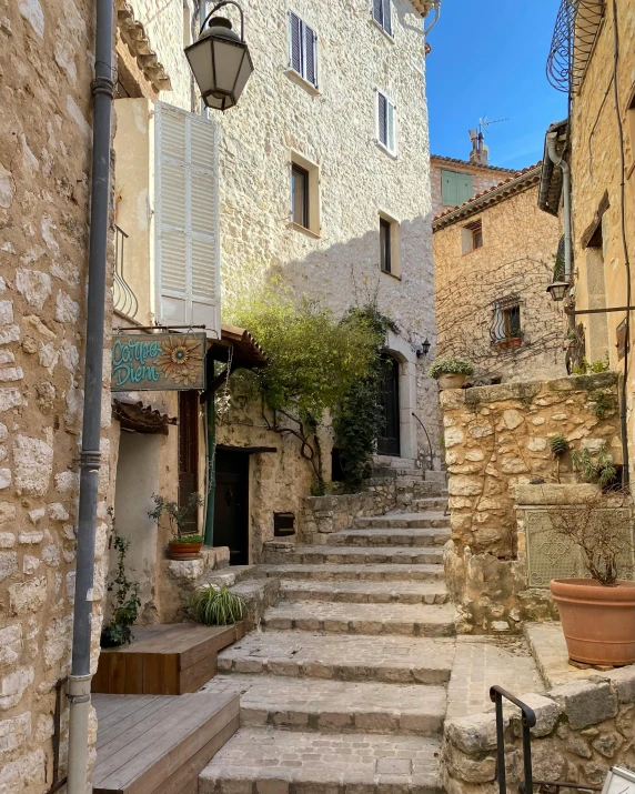 a stairway with some stone steps near buildings