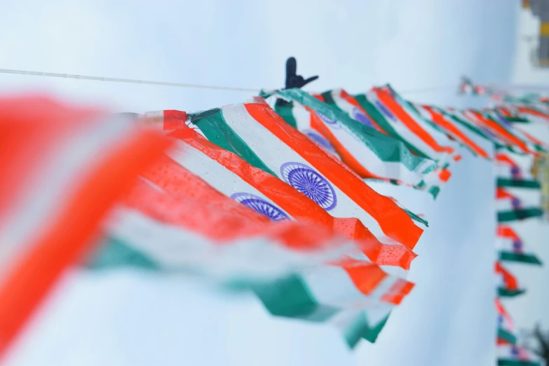 flags are hanging from a clothes line with one being unfurnished