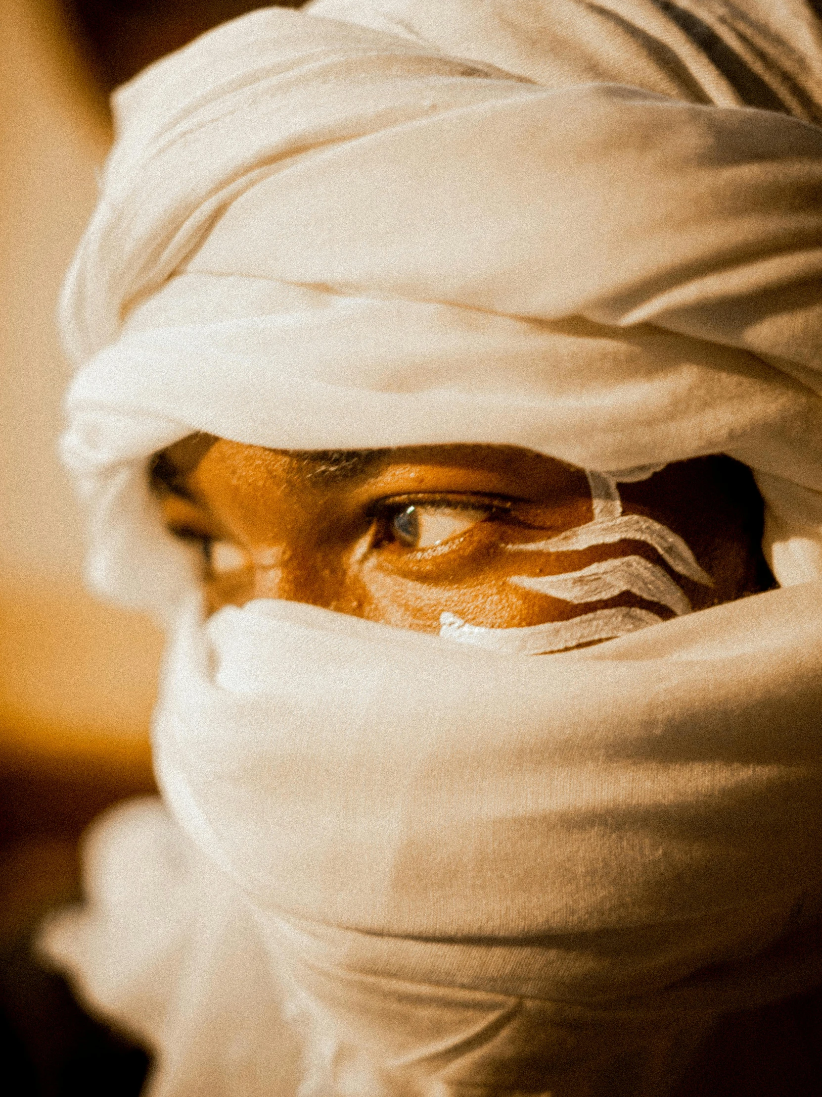 a man with his face wrapped up around his head