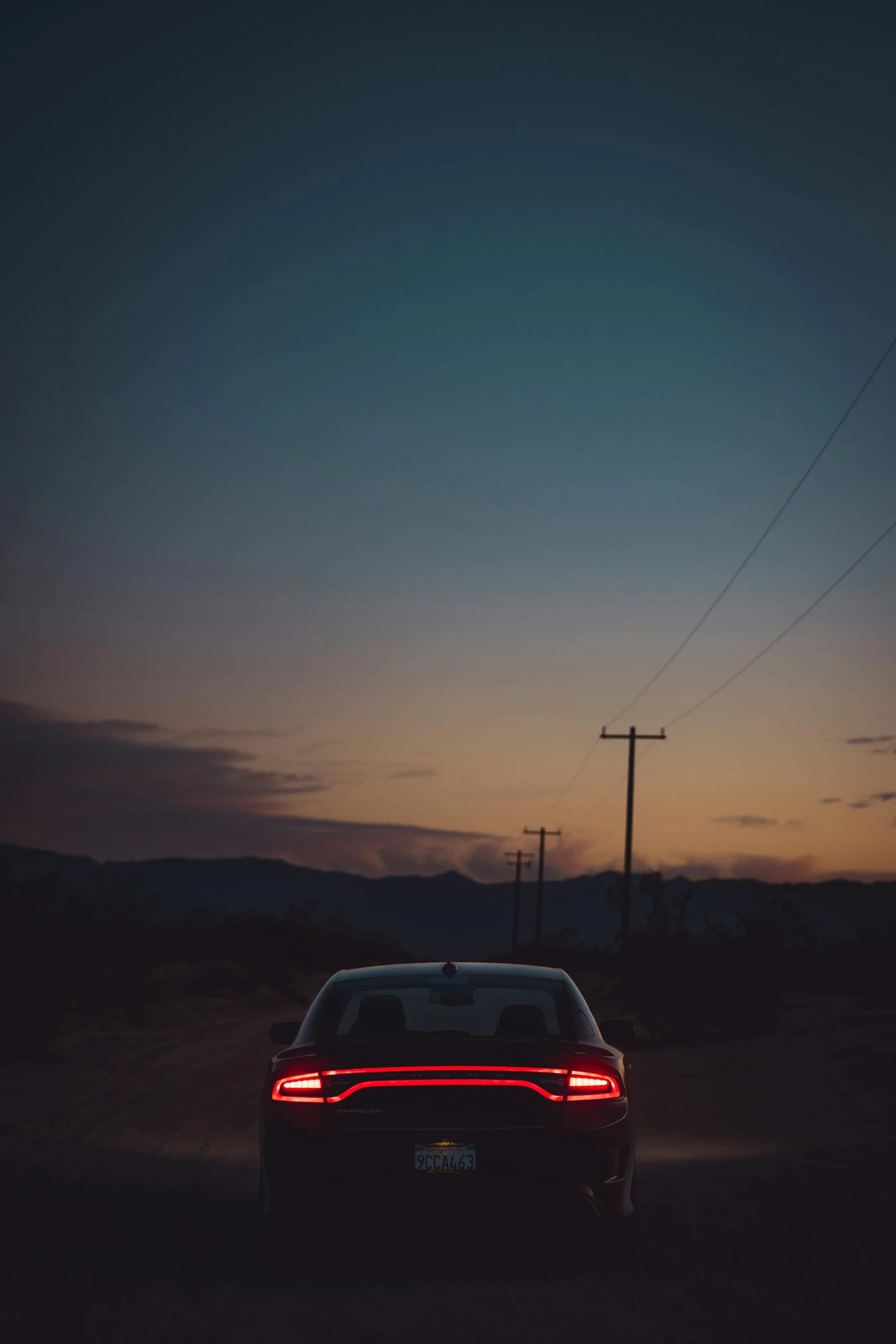 a car driving down the road at night