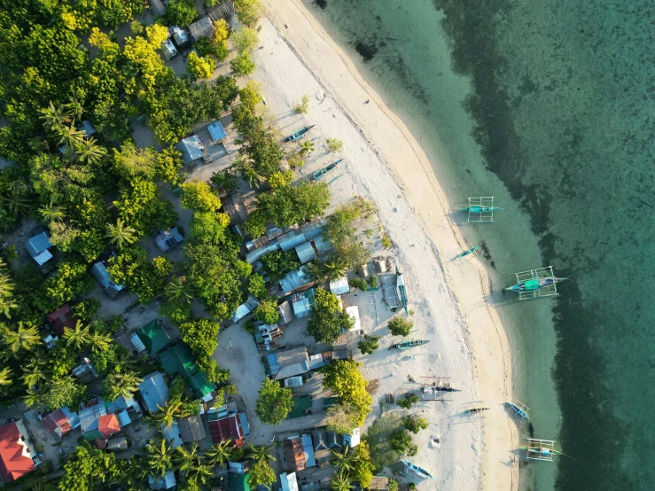 an overhead view of some small boat tied up to the beach