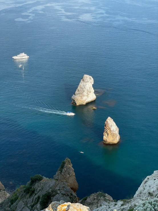 a view of a rocky beach near some ocean