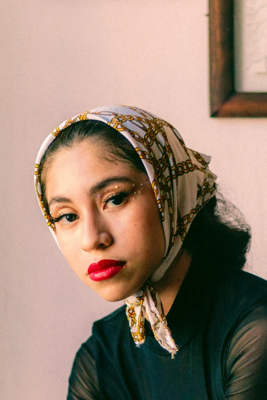 an indian woman with a turban looking off into the distance