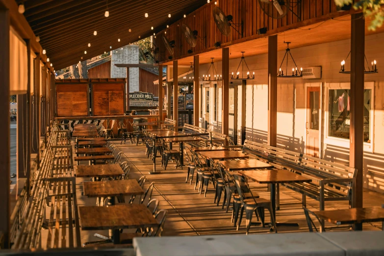 a row of tables sit in front of a building