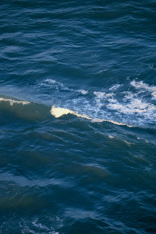 some large waves crashing into the shore