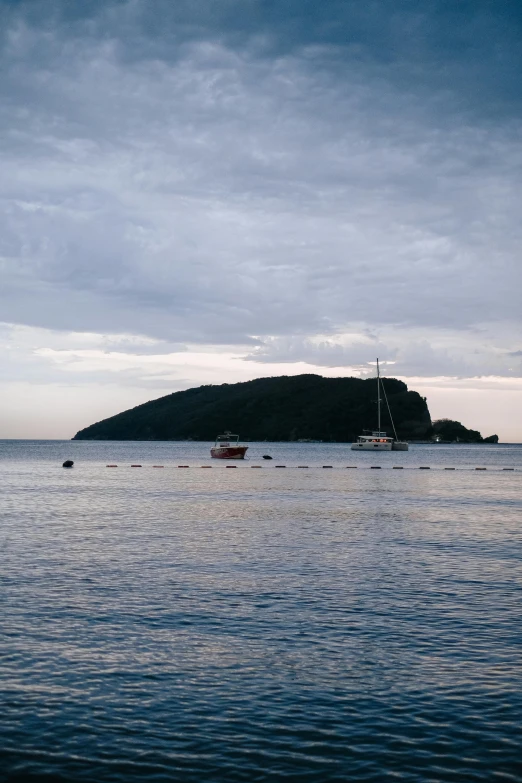 a body of water with two boats floating in it