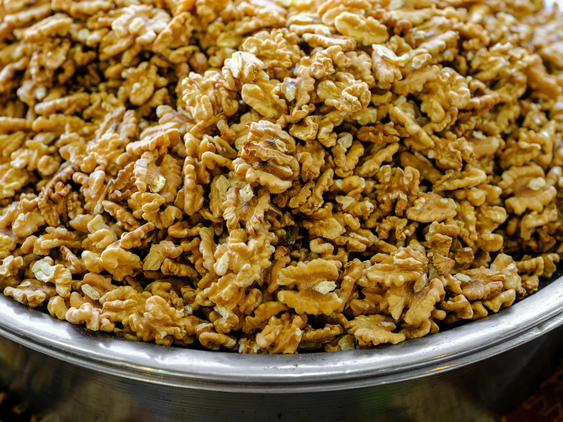 close up of a bowl with some nuts in it