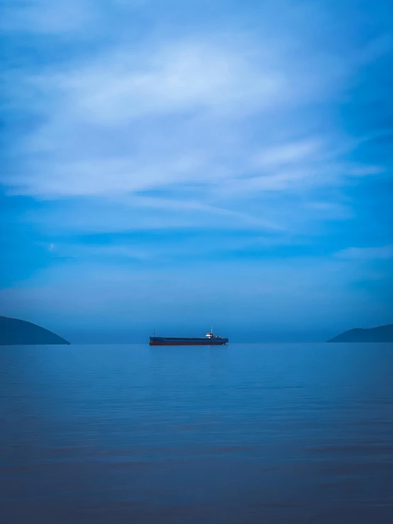 a small boat in a large body of water