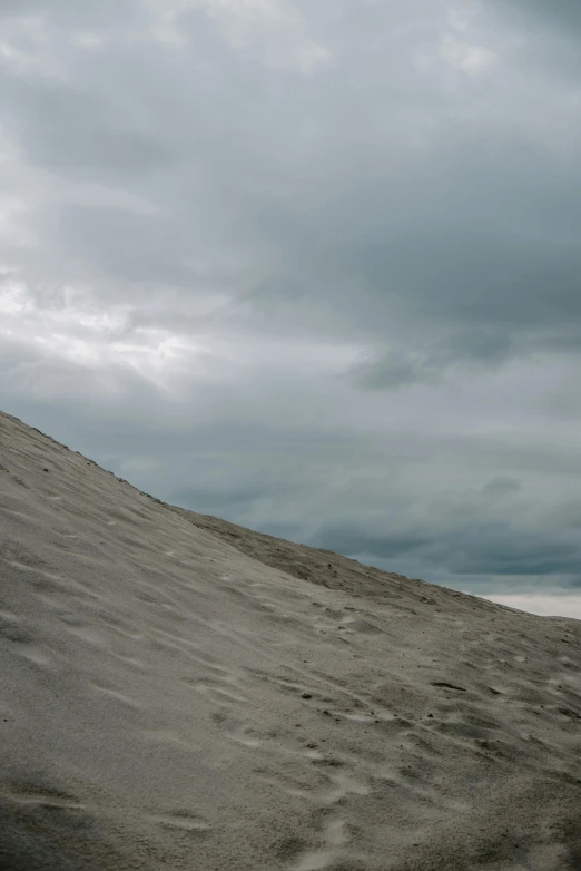 a person in a green jacket is riding a surfboard