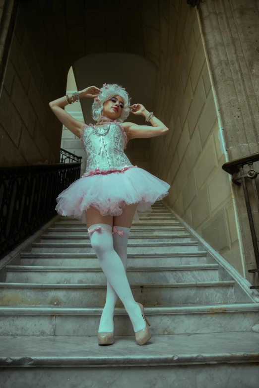 an older woman wearing a tutu while walking up a staircase