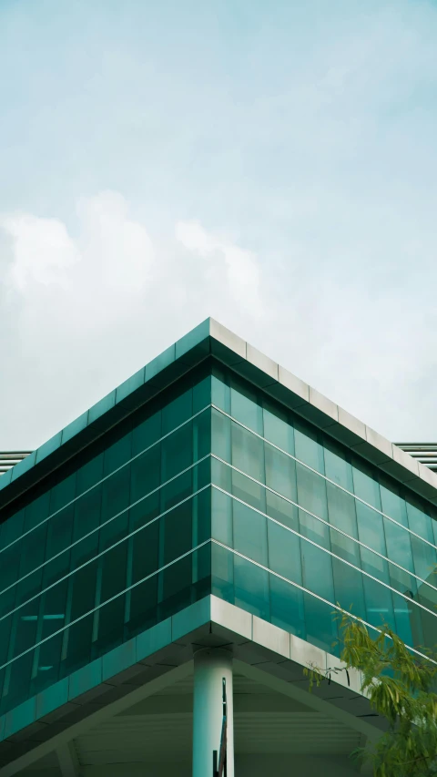 the side of an office building with a glass window