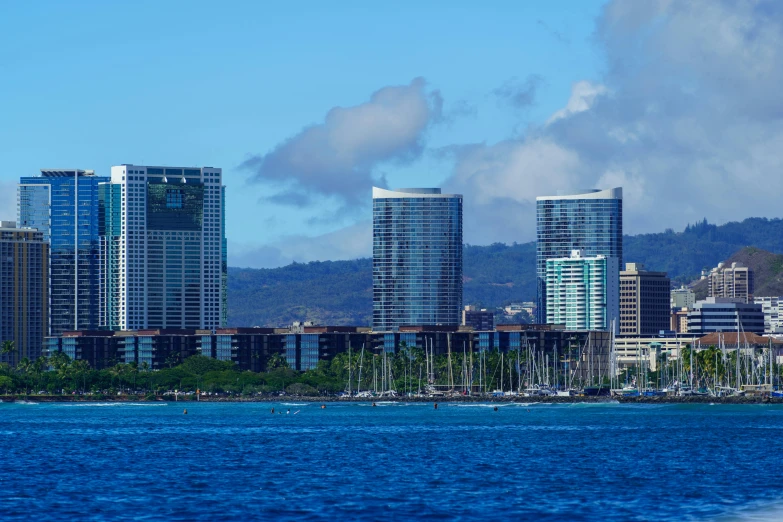 the skyline of some large city buildings on the coast