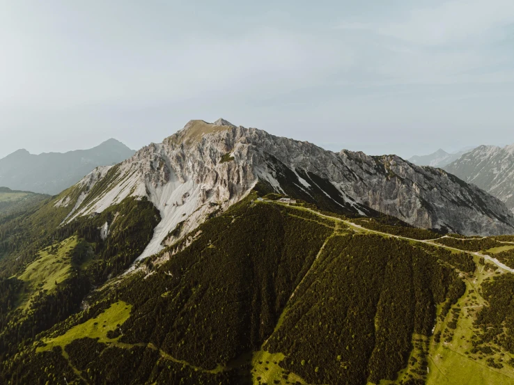 the mountains and valleys are covered in green vegetation