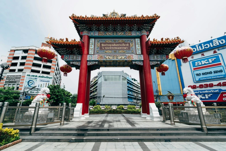 an oriental archway in the middle of the city