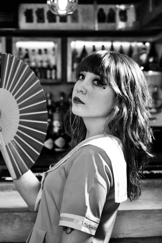 black and white pograph of a girl with a japanese umbrella