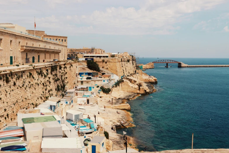 there are many colorful buildings in a village on the cliff