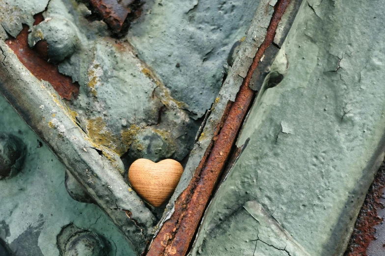 an old, dirty door frame with a heart in it