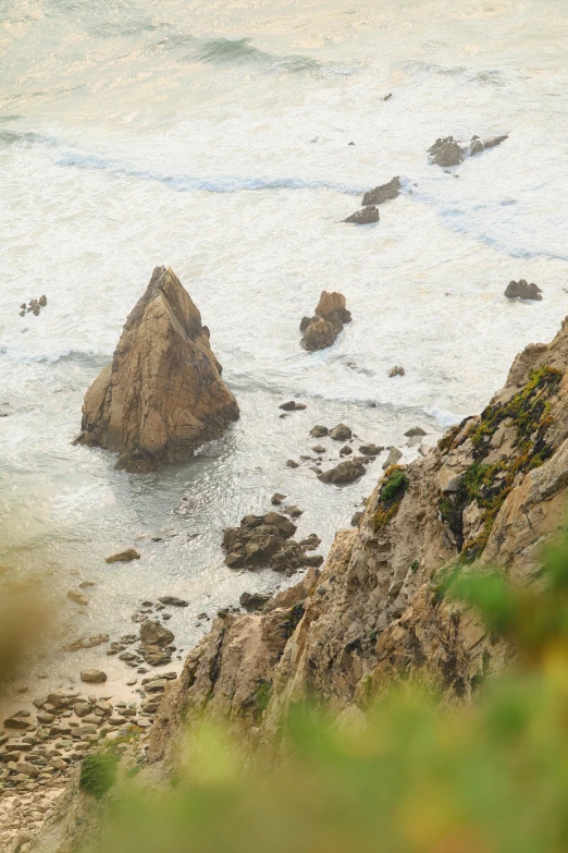 there is a small rock sticking out of the water