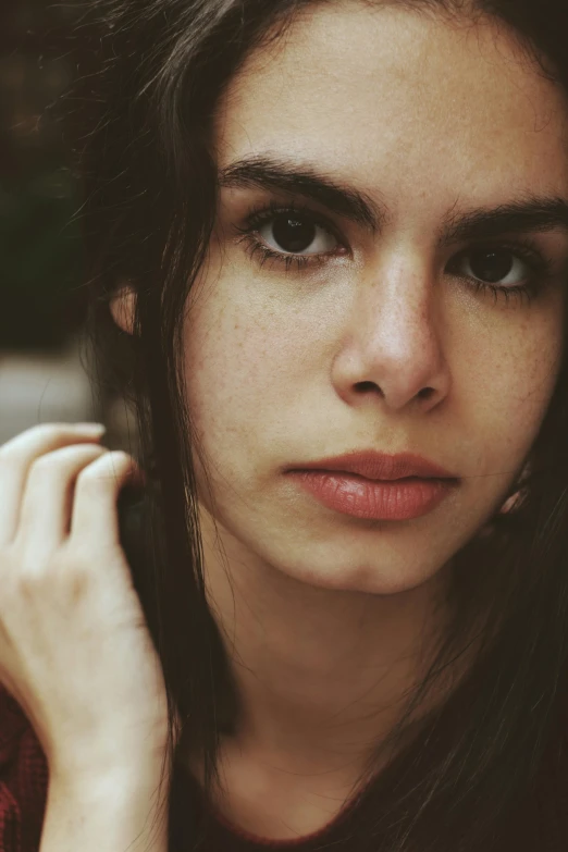 a close up of a person with long hair