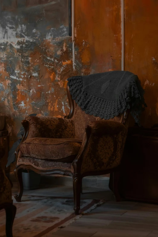 a chair in a room with no floor is next to an old wall