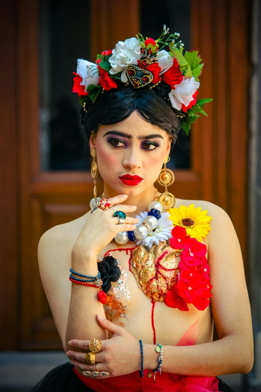 a woman wearing flower crown and jewelry