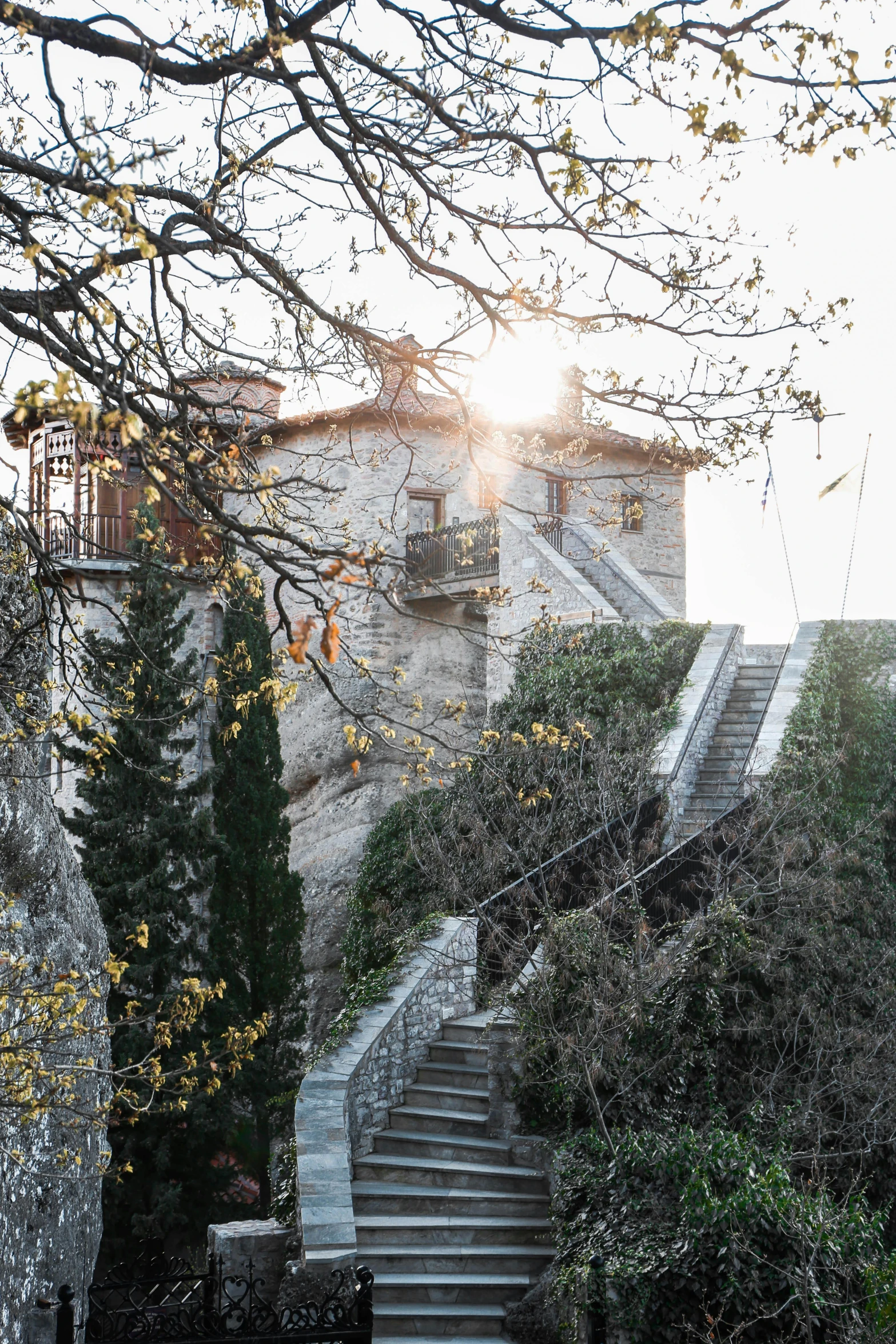 a stone staircase leads to an old building