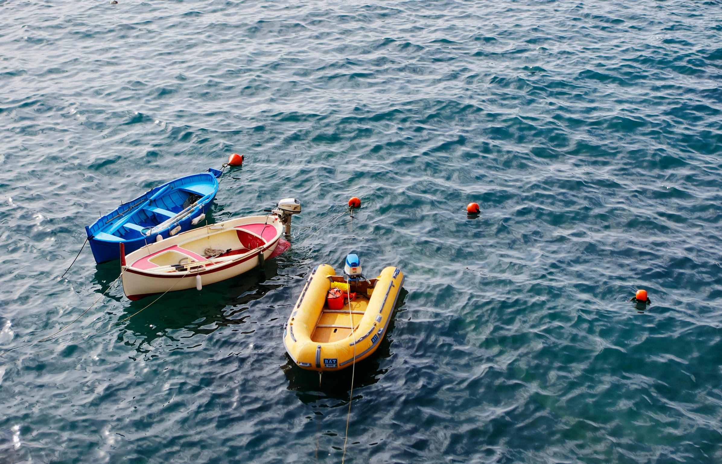 small boats are lined up in the water