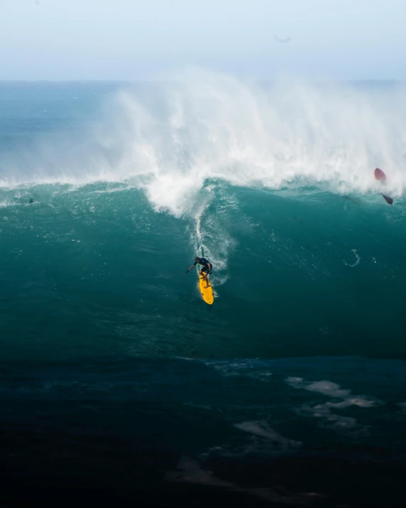 someone is surfing on the wave at ocean