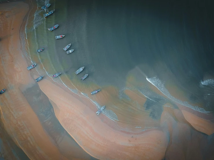 an aerial view of a beach and water