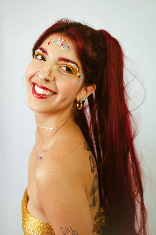 woman with bright gold and silver paint on her face