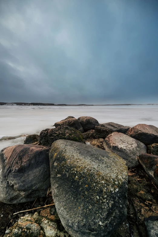 there is a rock that has been washed ashore by the waves