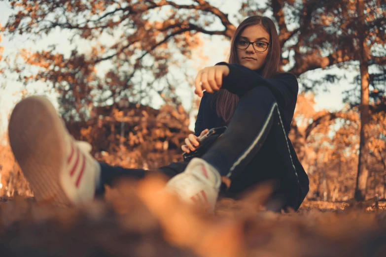 an image of a woman that is sitting on the ground