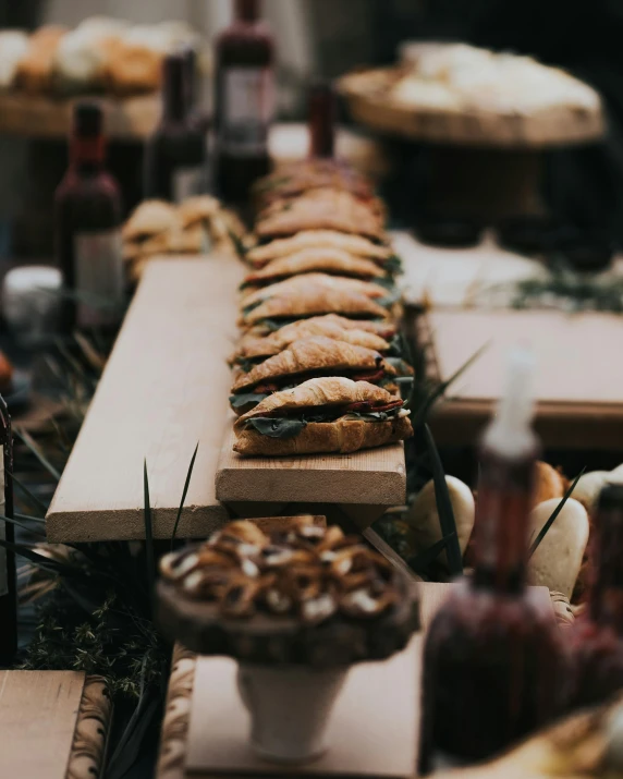 some pies are on wooden boards lined up