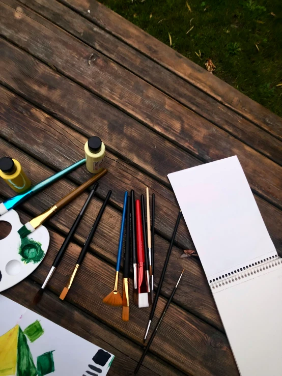 supplies on table laid out on outdoor bench