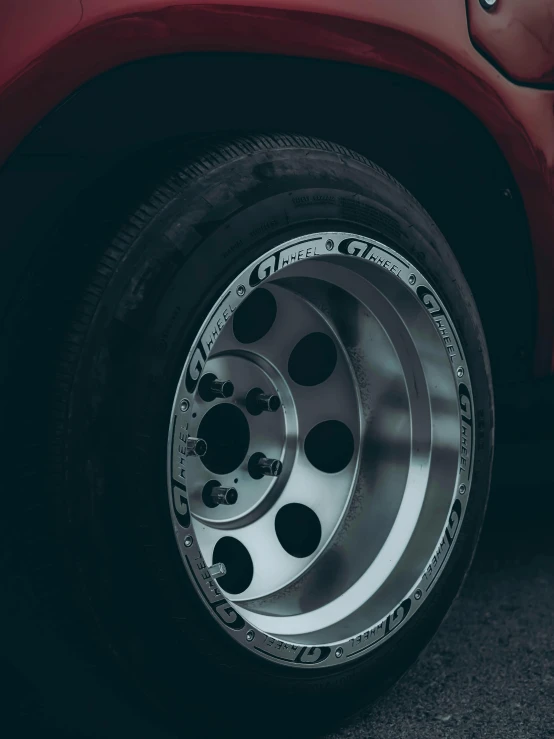 some wheel hubs on a car on a road