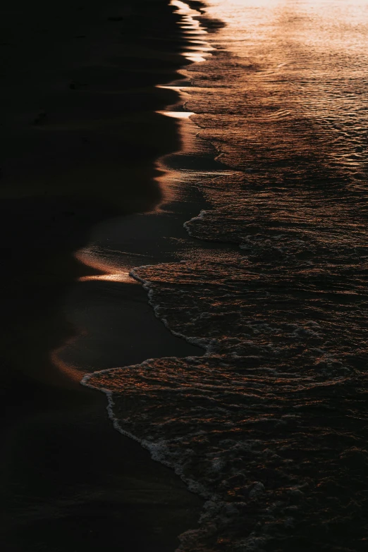 a body of water sitting in the middle of a beach