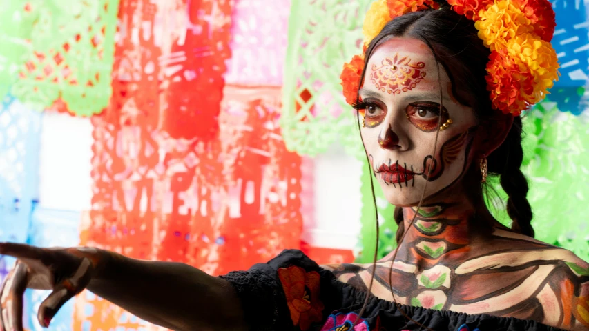 a beautiful woman with body painted like a skeleton