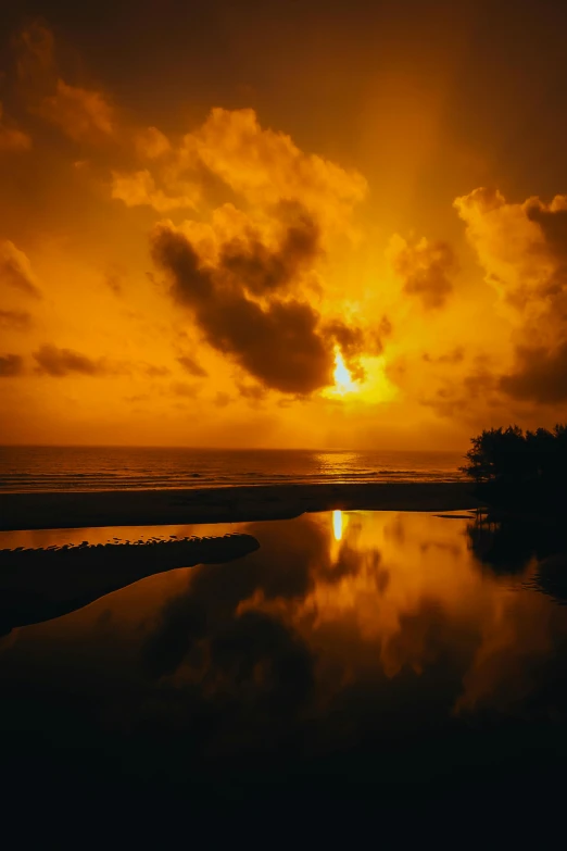 sunset on the water reflecting its reflection in it