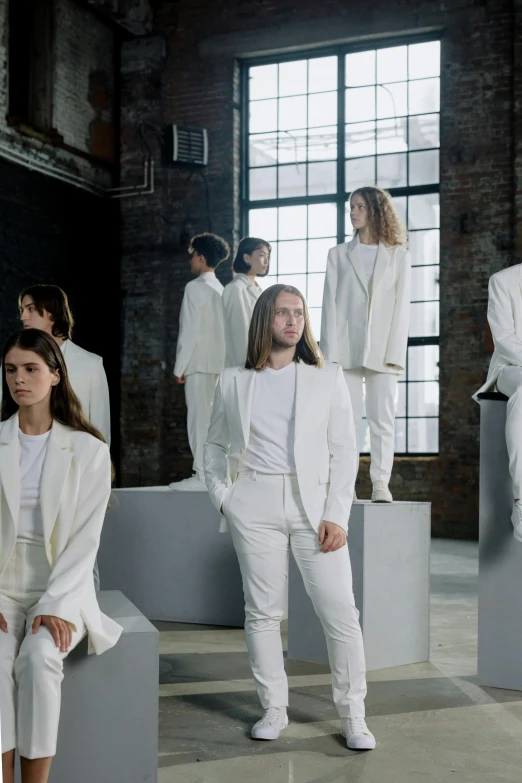 models in white outfits at a fashion show